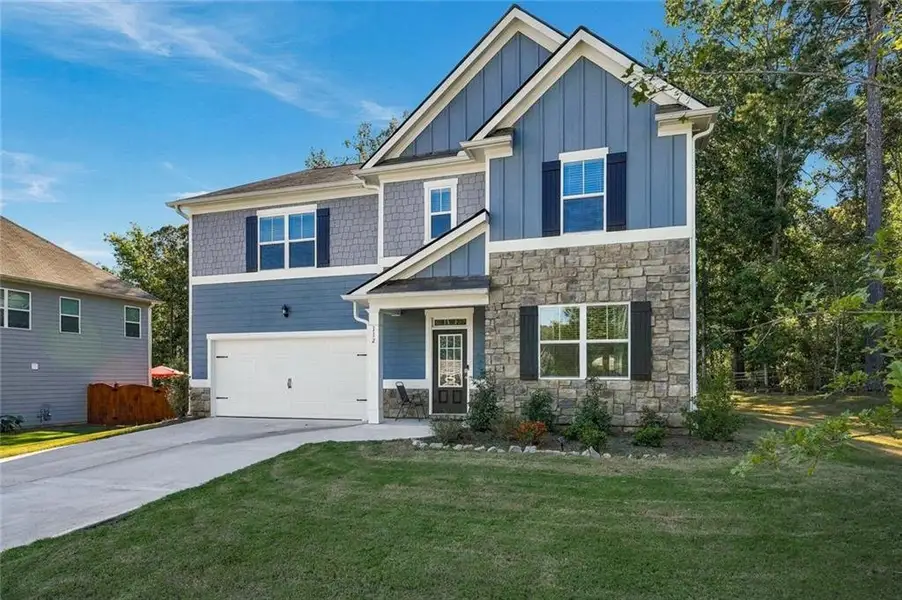 Front exterior of a new home in , Braselton, GA, highlighting curb appeal (Image 20). Front exterior of a new home in , Braselton, GA, highlighting curb appeal (Image 20).