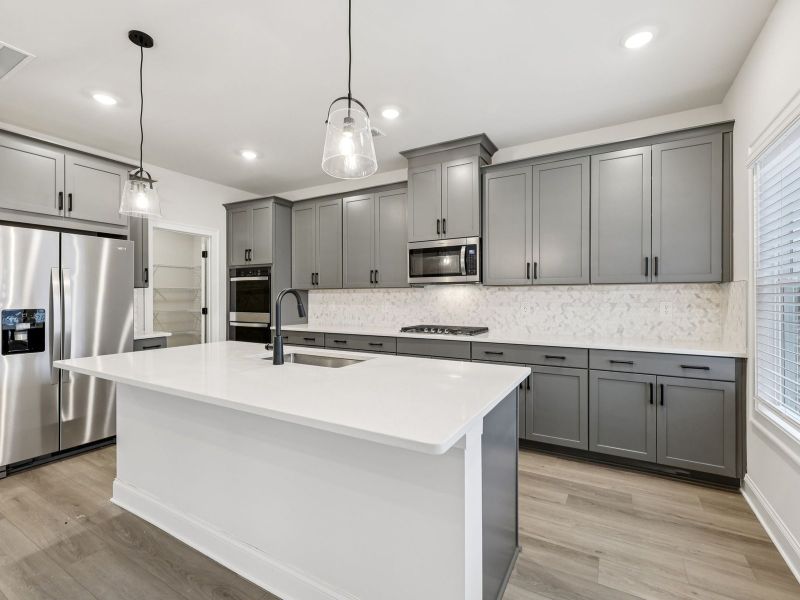 Furnished interior view inside a new home in Vines at Mill Creek - Estate Series, Braselton (Image 6).