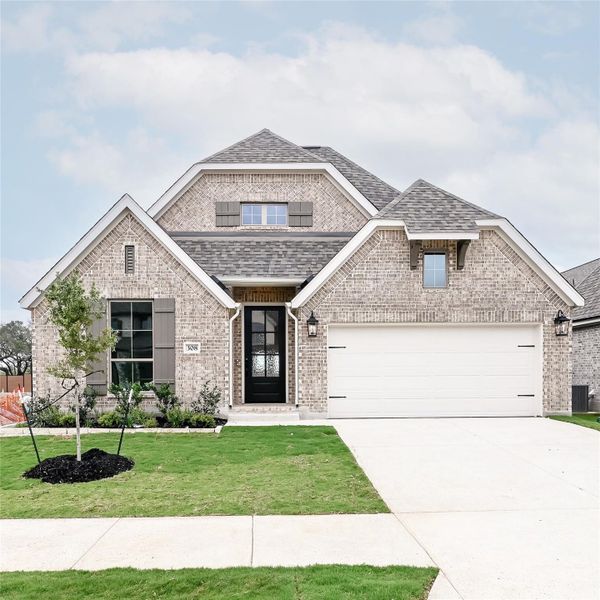 Front exterior of a new home in Juniper Springs, Lockhart, TX, highlighting curb appeal (Image 18).