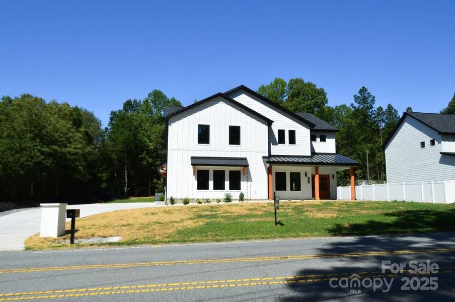 Front exterior of a new home in , Davidson, NC, highlighting curb appeal (Image 26).