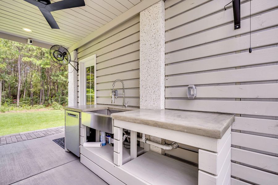 Exterior details and patio area of a home in Overlook at Copahee Sound, Awendaw (Image 33).