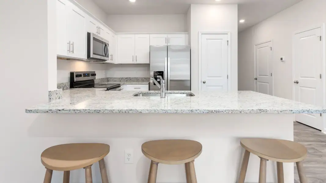 Furnished interior view inside a new home in North Village Townes, Greensboro (Image 6).