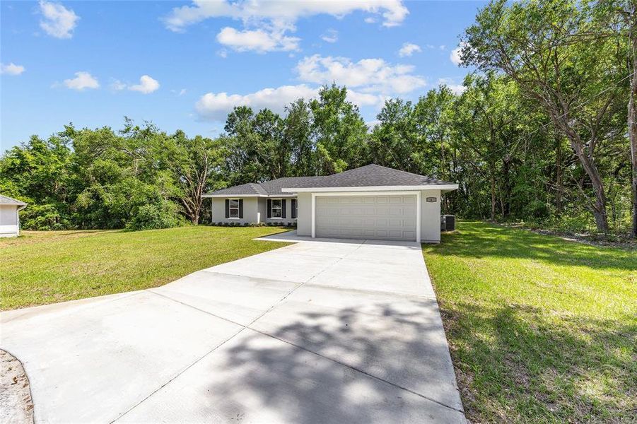 Front exterior of a new home in , Ocala, FL, highlighting curb appeal (Image 2).