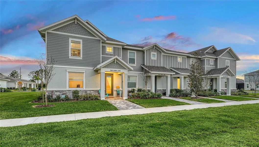 Front exterior of a new home in , Lakewood Ranch, FL, highlighting curb appeal (Image 21).