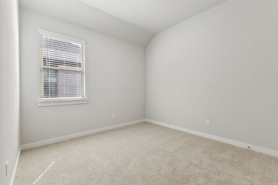 Bedroom in the Cedar home plan by Trophy Signature Homes – REPRESENTATIVE PHOTO