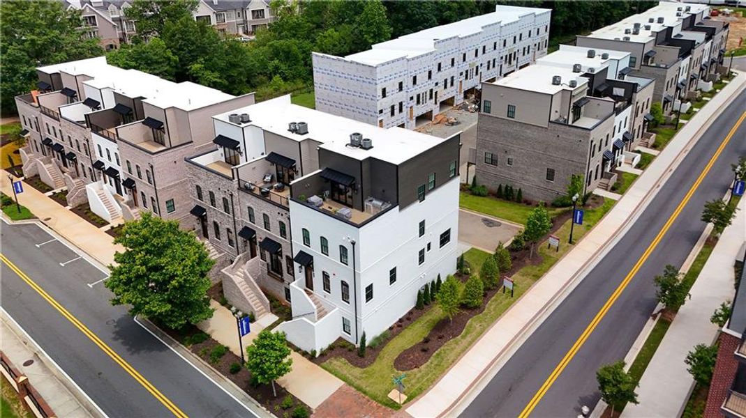 Front exterior of a new home in Skyview On Broad, Sugar Hill, GA, highlighting curb appeal (Image 26).