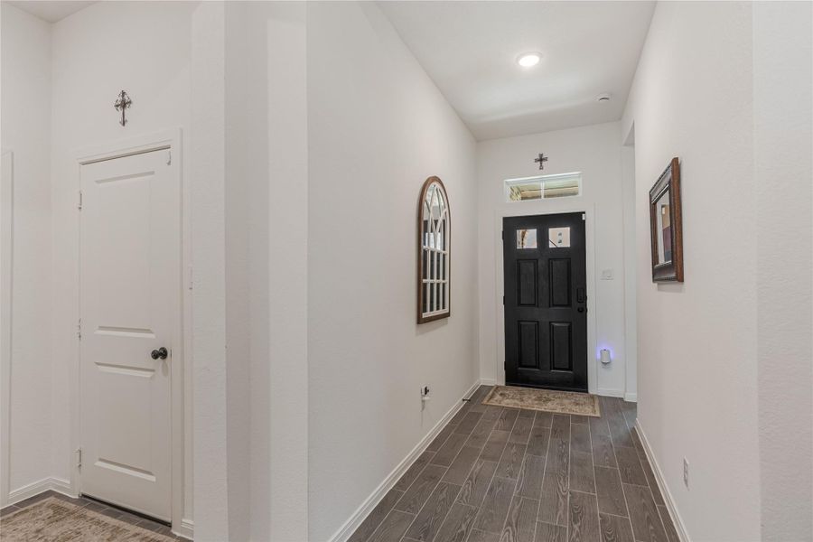 Another view of hallway showing the door leading to the garage.