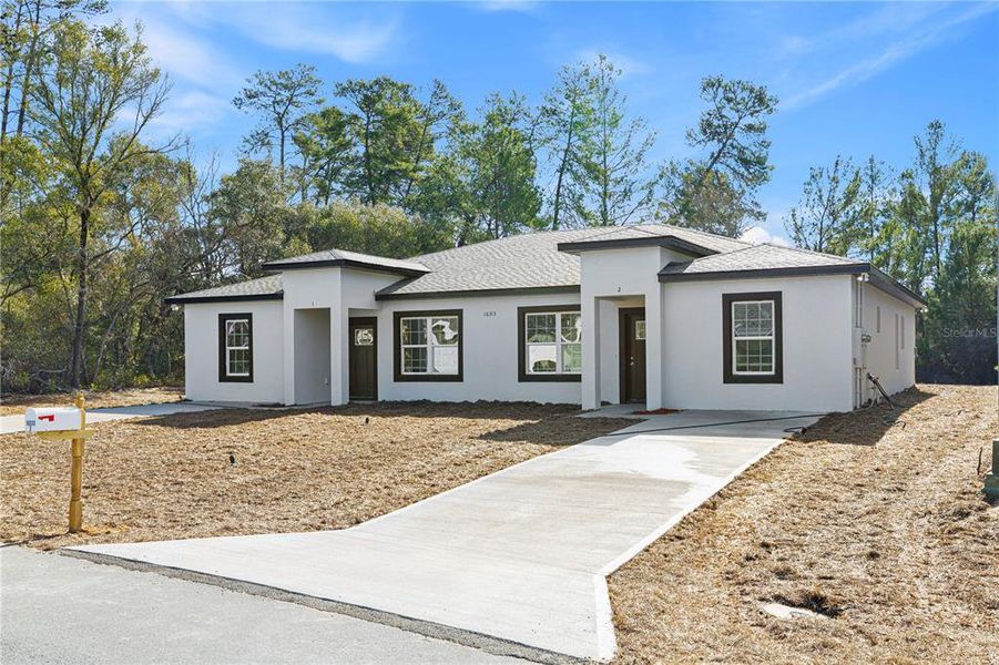 Front exterior of a new home in , Ocala, FL, highlighting curb appeal (Image 19).