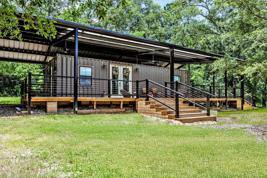 Exterior details and patio area of a home in , New Waverly (Image 23). Exterior details and patio area of a home in , New Waverly (Image 23).