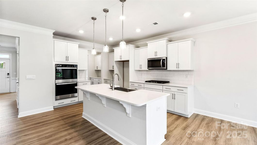 Photo is representative but kitchen cabinets are white