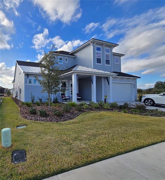Front exterior of a new home in Oakmont, Gainesville, FL, highlighting curb appeal (Image 1). Front exterior of a new home in Oakmont, Gainesville, FL, highlighting curb appeal (Image 1).
