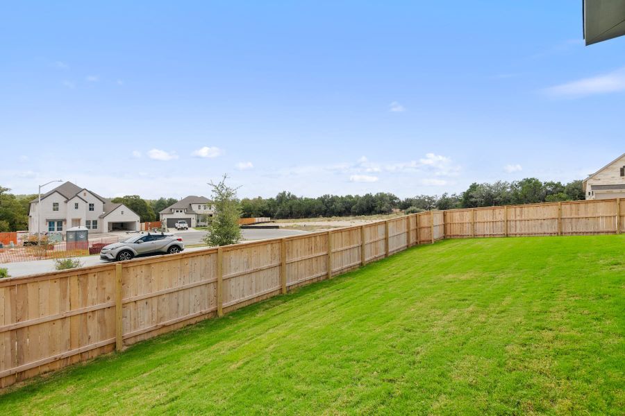 Exterior details and patio area of a home in Lariat, Liberty Hill (Image 30).