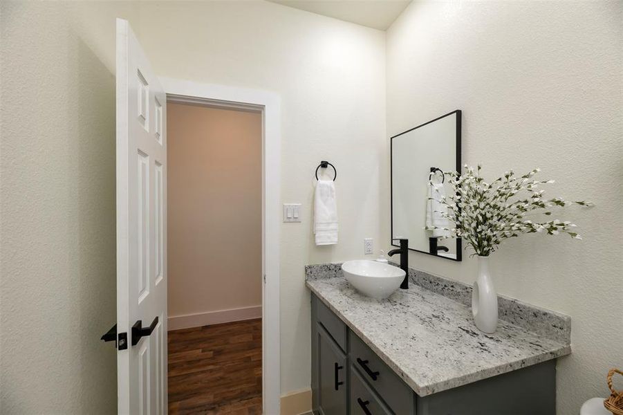 Granite counter and decorative sink in 2nd full bath.