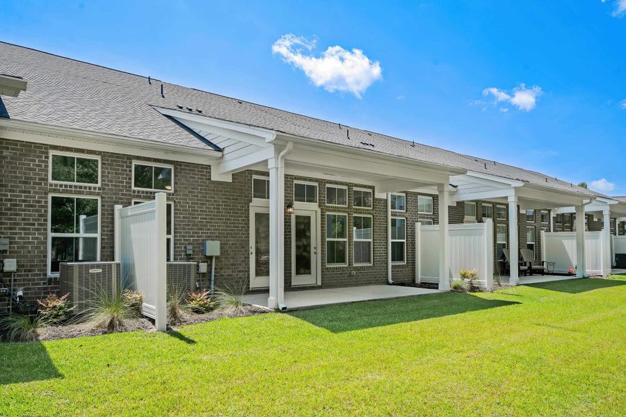 Exterior details and patio area of a home in Long Bay Golf Club, Longs (Image 23).