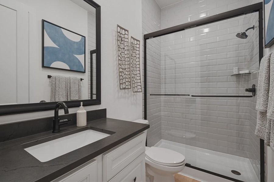 Representative furnished interior of a home built from the Hampton by Chesmar Homes in Lakes of Cane Island, Katy (Image 16).
