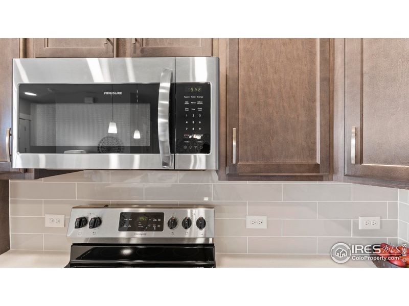 Kitchen - photos not of actual unit - finishes may vary Kitchen - photos not of actual unit - finishes may vary