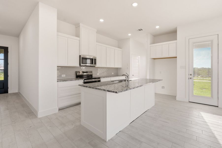 Furnished interior view inside a new home in Saddleback Estates, Boyd (Image 6).