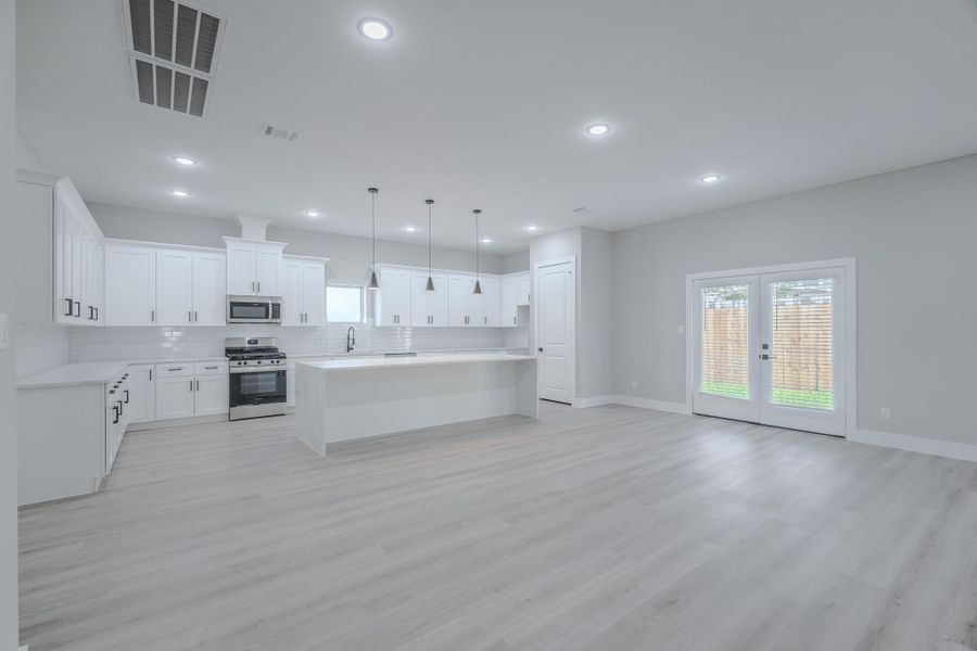 Dining room sits conveniently off the kitchen for seamless flow