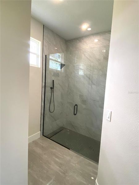 master walkin tiled shower with rain head shower