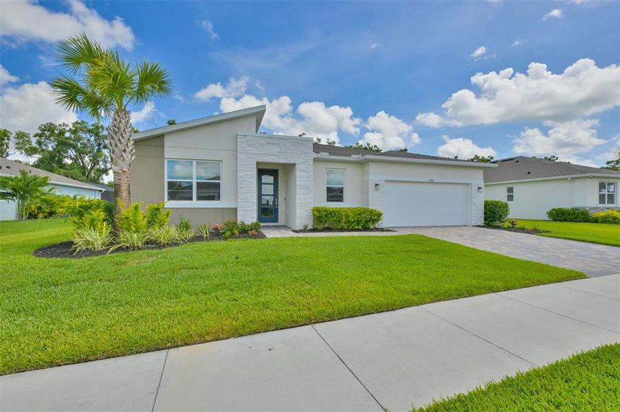 Front exterior of a new home in , Parrish, FL, highlighting curb appeal (Image 23).