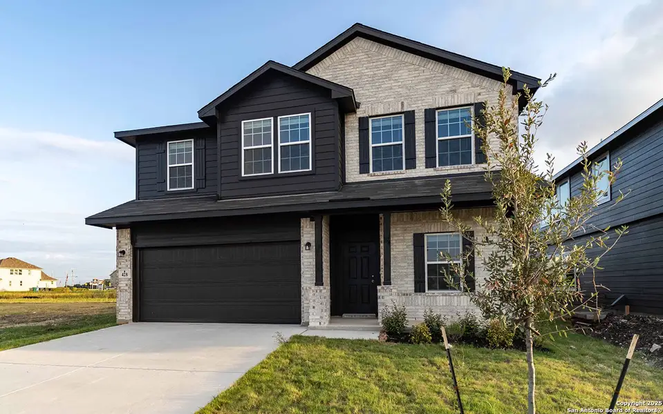 Front exterior of a new home in Hannah Heights, Seguin, TX, highlighting curb appeal (Image 11). Front exterior of a new home in Hannah Heights, Seguin, TX, highlighting curb appeal (Image 11).