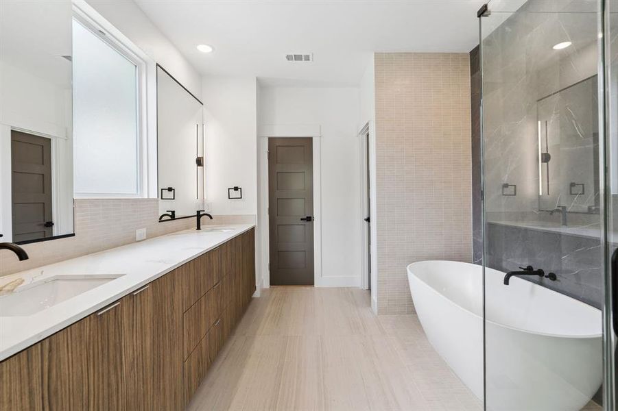 Primary bathroom with soaking tub and separate walk in shower.