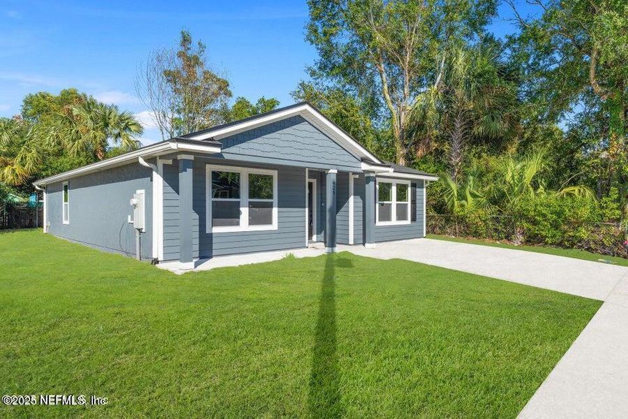 Front exterior of a new home in , Jacksonville, FL, highlighting curb appeal (Image 16).