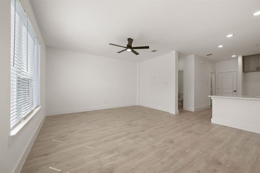 Our light, bright and airy Julia plan streams in natural light from a wall of windows in the family room.