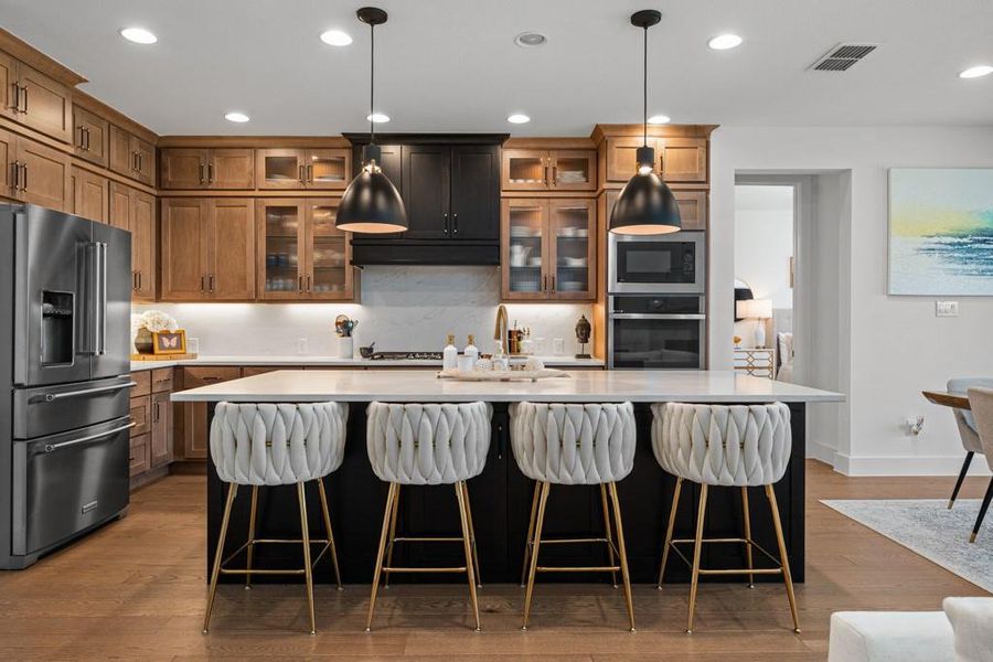 Culinary excellence awaits in this well-appointed kitchen, featuring a spacious island and gleaming stainless steel appliances. Culinary excellence awaits in this well-appointed kitchen, featuring a spacious island and gleaming stainless steel appliances.