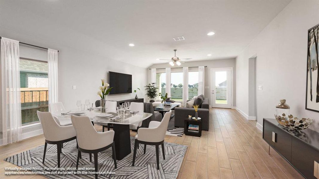 Dining area featuring ceiling fan and light hardwood / wood-style flooring