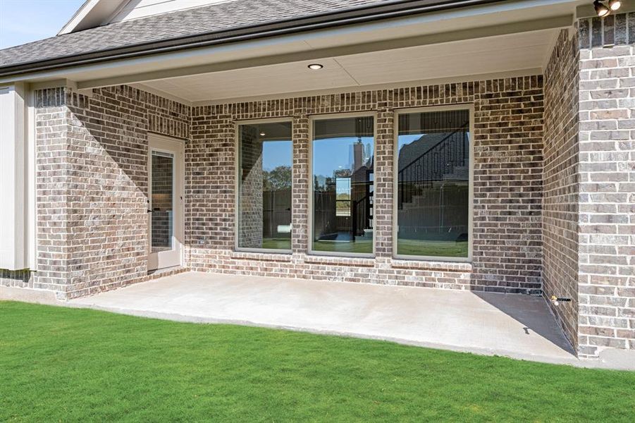Exterior details and patio area of a home in Meadow Vista 60-65, Anna (Image 3). Exterior details and patio area of a home in Meadow Vista 60-65, Anna (Image 3).