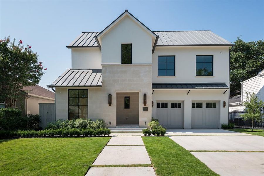 Modern farmhouse with a garage and a front yard