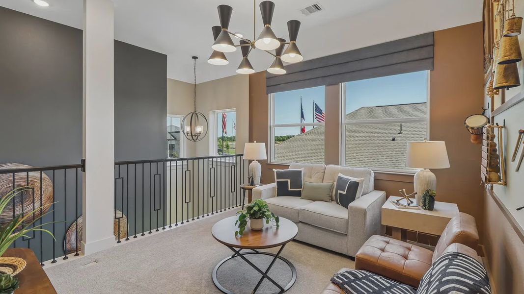 Furnished interior view inside a new home in Meridiana Chateau, Manvel (Image 11).