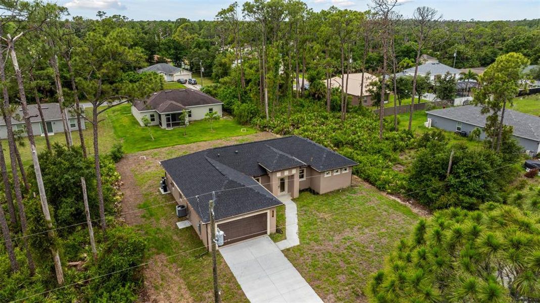 Front exterior of a new home in , North Port, FL, highlighting curb appeal (Image 28). Front exterior of a new home in , North Port, FL, highlighting curb appeal (Image 28).