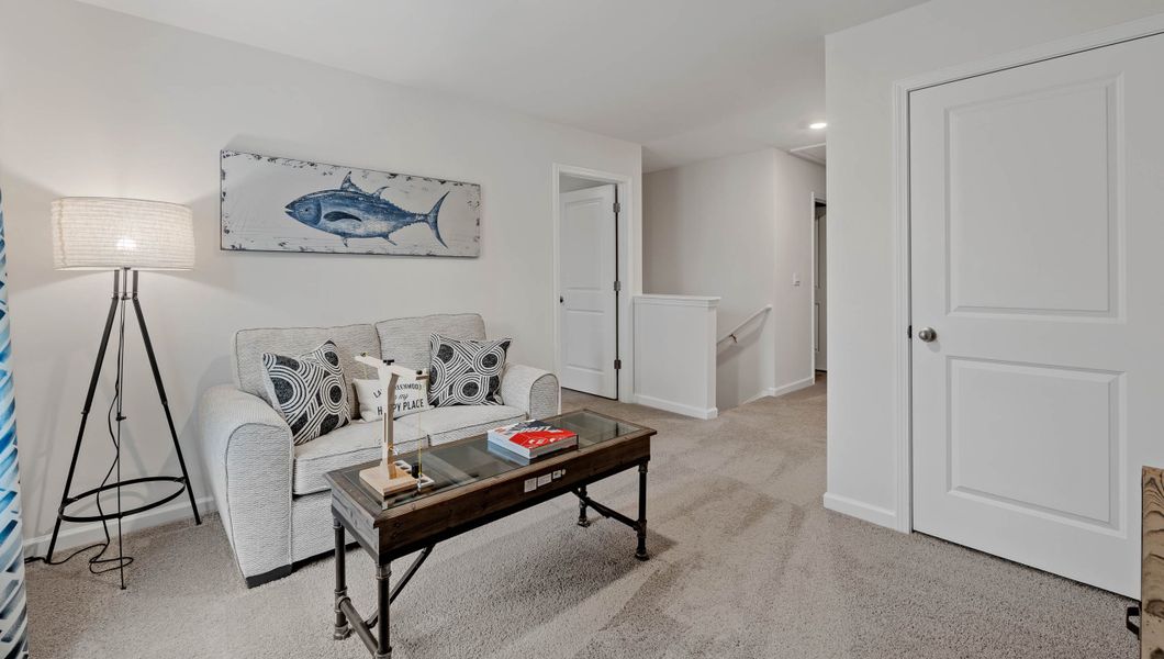 Furnished interior view inside a new home in Bentley Park, Greenwood (Image 27).