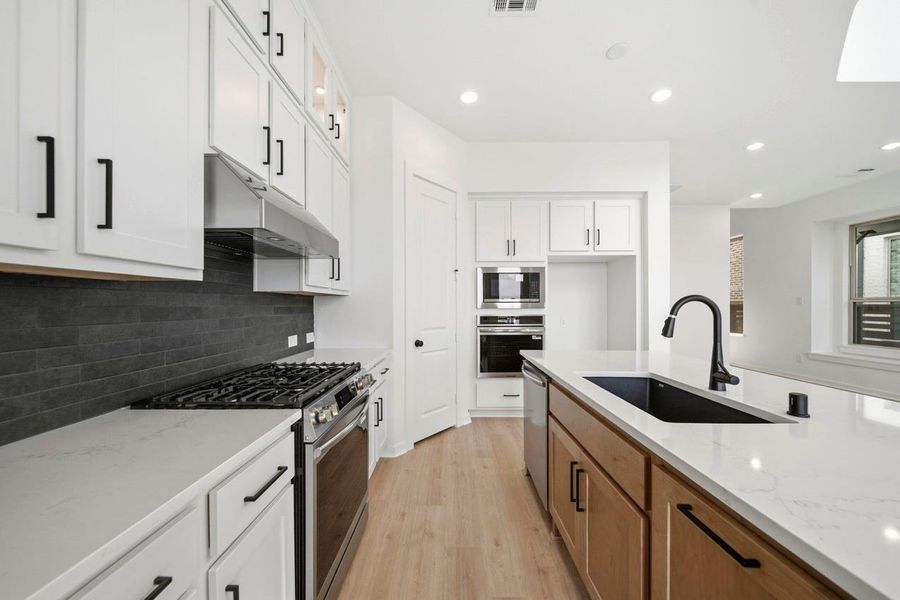 Furnished interior view inside a new home in Bridgeland, Cypress (Image 5).