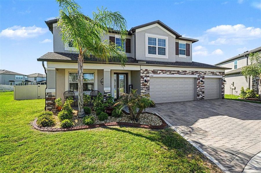 Front exterior of a new home in Berry Bay, Wimauma, FL, highlighting curb appeal (Image 21).