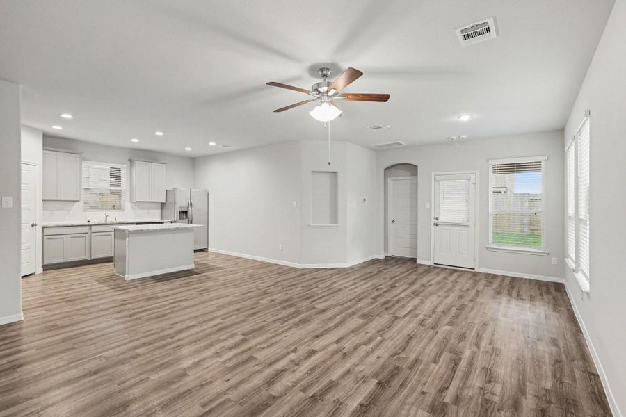 Open living and dining space with easy flow to the kitchen and backyard access. Open living and dining space with easy flow to the kitchen and backyard access.