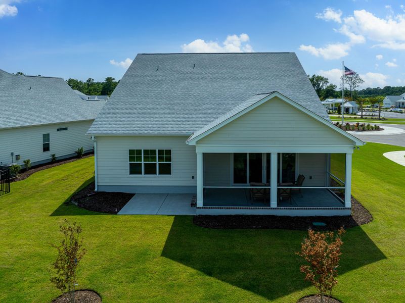 Front exterior of a new home in The Sanctuary at Sunset Beach, Sunset Beach, NC, highlighting curb appeal (Image 17).