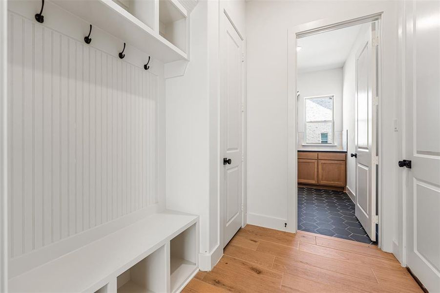 Mudroom with light wood-style flooring