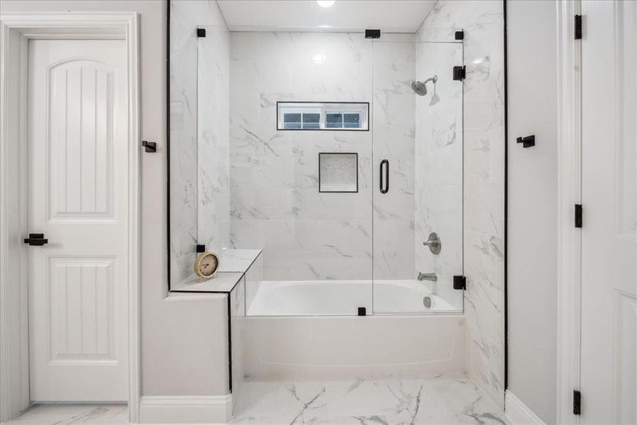 Bathroom featuring enclosed tub / shower combo