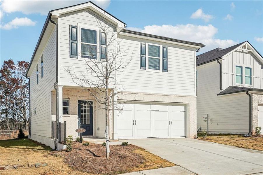 Front exterior of a new home in Hawthorne Station, College Park, GA, highlighting curb appeal (Image 2). Front exterior of a new home in Hawthorne Station, College Park, GA, highlighting curb appeal (Image 2).