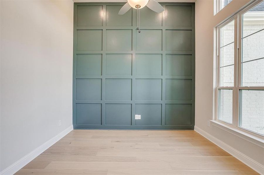 Spare room with light hardwood / wood-style flooring and ceiling fan