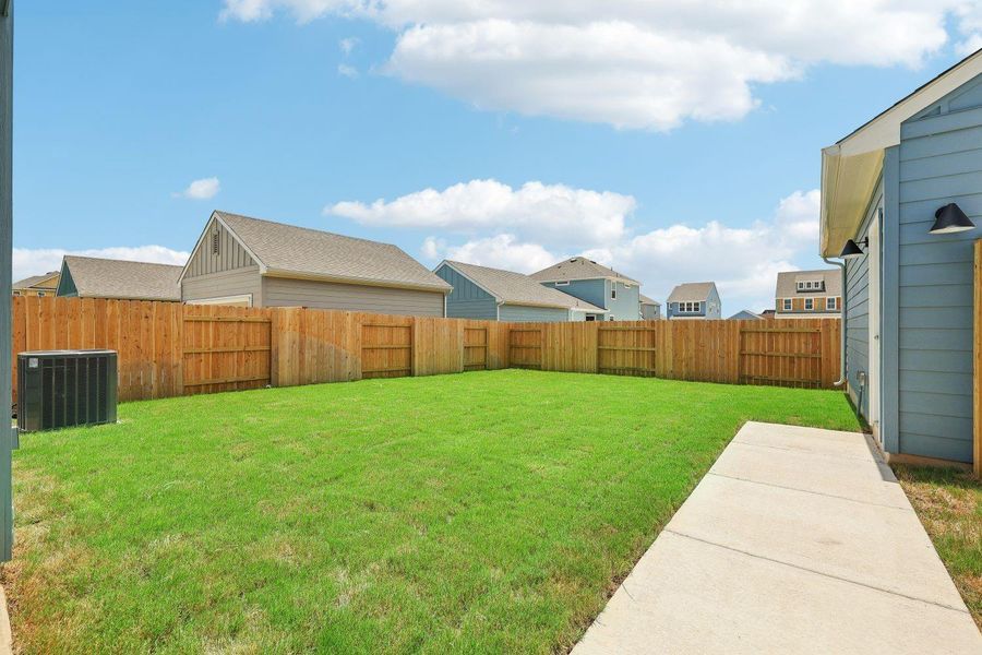 Backyard w/ walkway to garage access