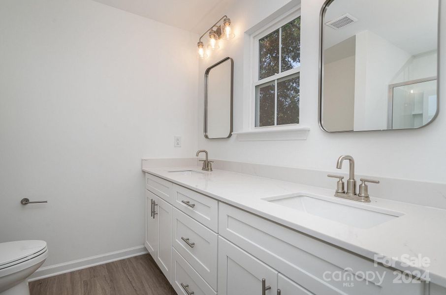 Primary bathroom with double vanity - Representative Photo