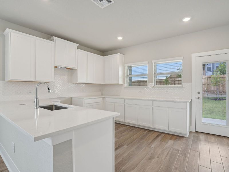 Kitchen in the Medina floorplan at a Meritage Homes community. Kitchen in the Medina floorplan at a Meritage Homes community.