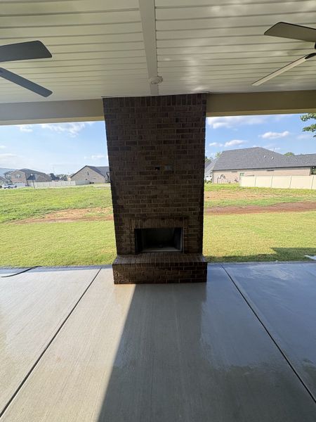 Jumbo covered porch with 2 ceiling fans and brick wood burning fireplace Jumbo covered porch with 2 ceiling fans and brick wood burning fireplace
