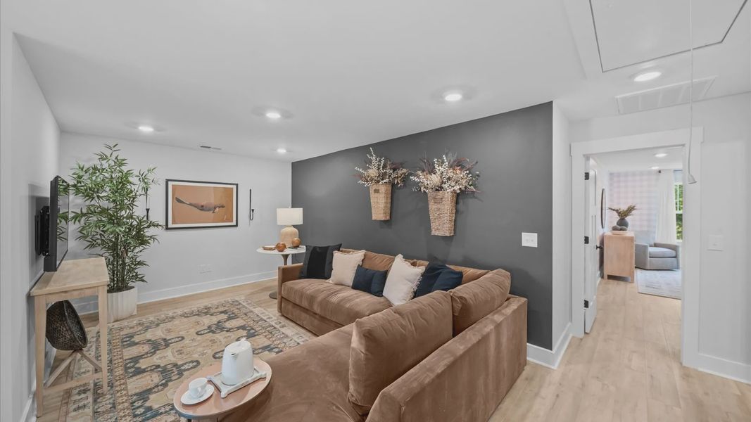 Hardwood flooring enhances the versatility of this elegant upper-level loft space in Fountain Inn, SC