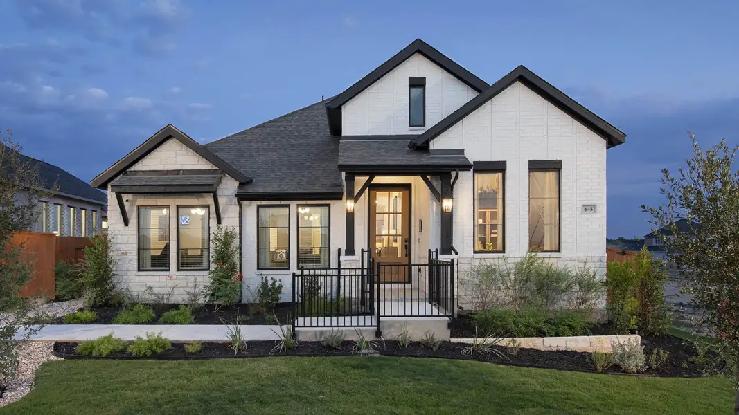 Front exterior of a new home in Parkside on the River West, Georgetown, TX, highlighting curb appeal (Image 2).