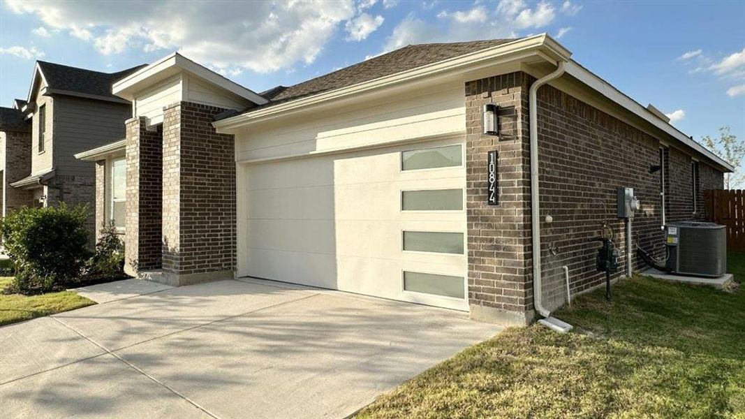 Front exterior of a new home in Rock Creek Ranch, Fort Worth, TX, highlighting curb appeal (Image 2).